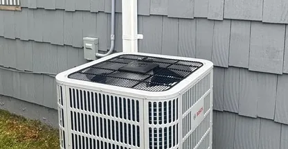 Central Air Systems technician performing annual AC tune-up on Long Island