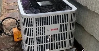 High-efficiency outdoor condenser unit on concrete pad