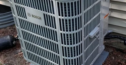 Seasonal air conditioning maintenance in progress at Suffolk County home