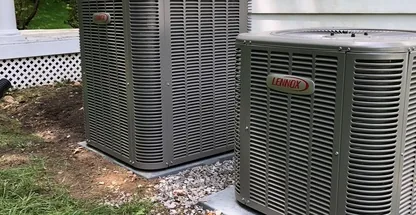 Outdoor condenser on mounting pad with proper clearance