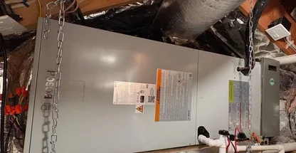 Furnace burner cleaning during maintenance visit on Long Island