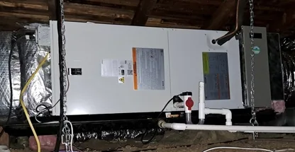 Technician testing furnace gas valve pressure during tune-up