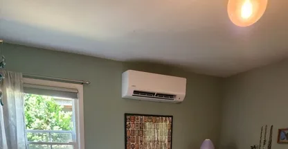 Ceiling cassette mini-split unit receiving professional service