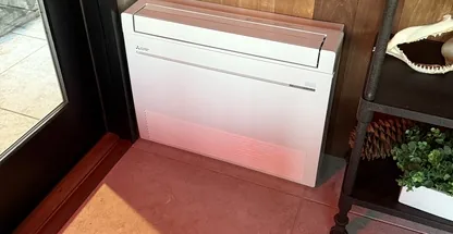 Ceiling cassette mini-split unit receiving professional maintenance cleaning