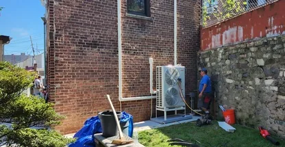 Multi-zone ductless condenser inspected during service call in Suffolk County