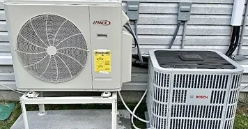 Central Air Systems heat pump condenser unit on Long Island home